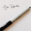 Retouched preview of a signed Ava Devlin bookplate with pen; final size and format to be confirmed.